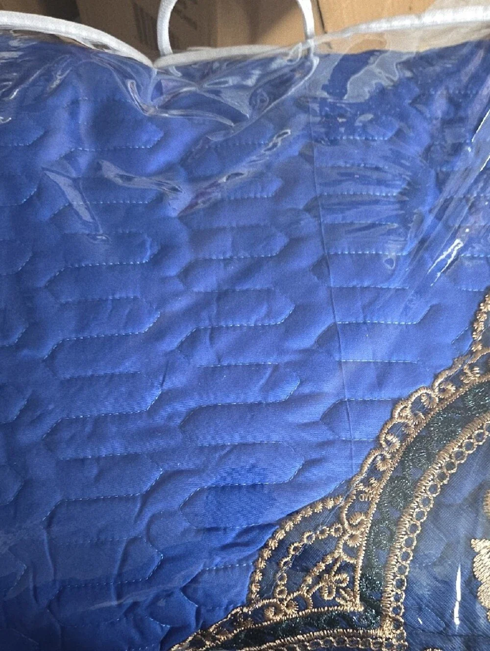 Blue Decorative Bedspread with Gold Accents